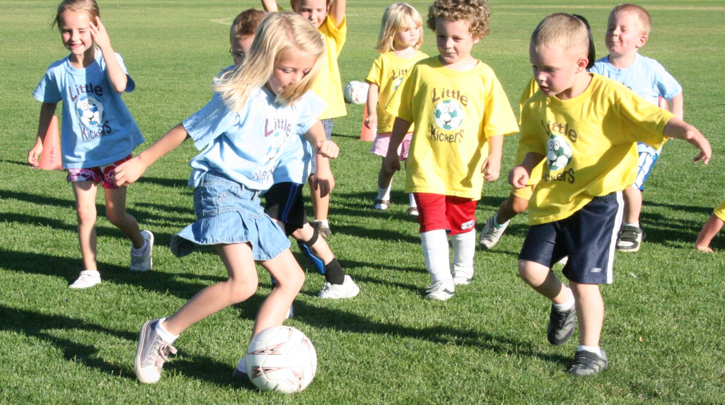 Young kids playing soccer